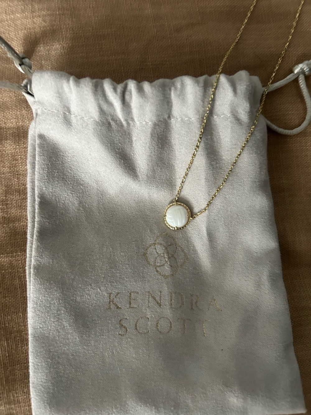 Kendra Scott Gold Necklace with White Mother-of-Pearl Volleyball Pendant